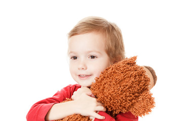 Boy playing with teddy bear isolated on white