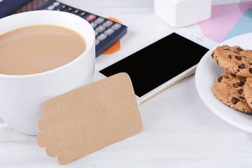 Empty note paper with coffee, cookies and calculator