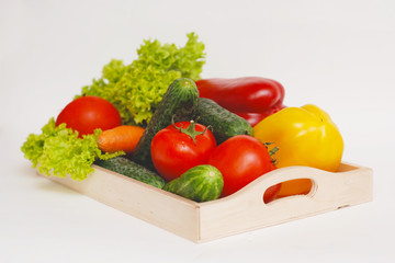 Fresh Summer Vegetables in Wooden Box Isolated. Organic Vegetables Vegetarian Vegan Health food Eatting