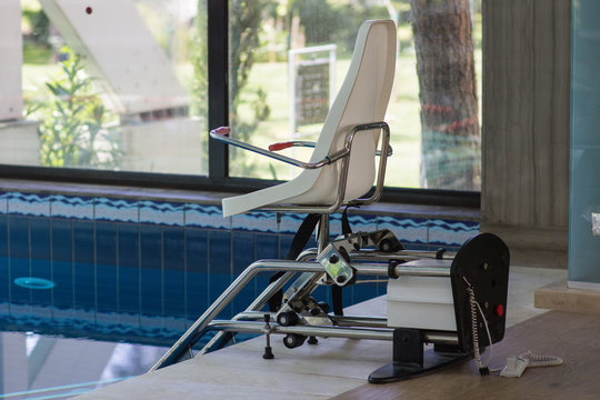 Chair Lift Device For Disabled People In Close Swimming Pool