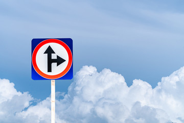 Traffic signs say it is a junction. Can be straight and turn right. Sky background. Copy space.