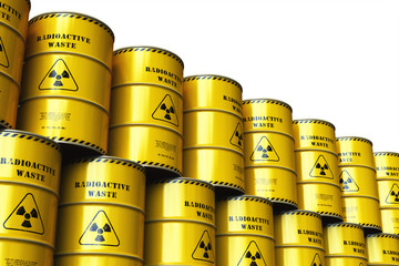 Group of stacked yellow drums with radioactive waste