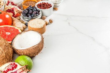 Set of organic healthy diet food, superfoods - beans, legumes, nuts, seeds, greens, fruit and vegetables.. white background copy space