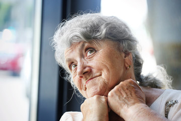 Thoughtful and looking grandmother face