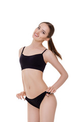 Fototapeta premium woman with perfect sporty body in black lingerie
