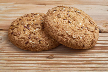 closeup oat large biscuits with sesame, flax and sunflower seeds. Macro