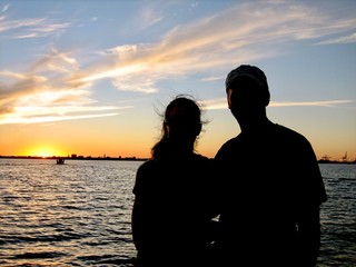 Sunset Silhouette of couple at Beach 