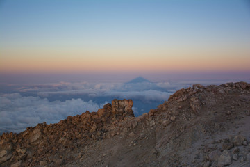 The shadow of Teide Mount at sunrise. Beautiful view from the top of the Teide Volcano, Tenerife  Island, Canary
