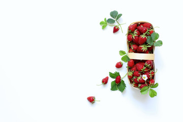 basket with fresh strawberries on a white background top view
