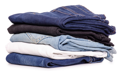 Stack of jeans on a white background isolation