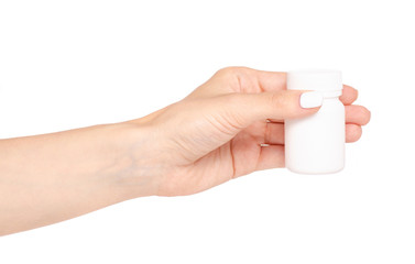 White jar of pills in hand on white background isolation