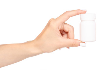 White jar of pills in hand on white background isolation