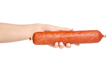 A smoked sausage in hand on a white background isolation