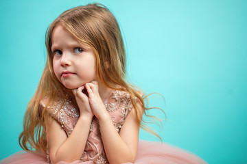 Offended but lovely little girl refusing to obey. 4 year old female child with frowning eyebrows...