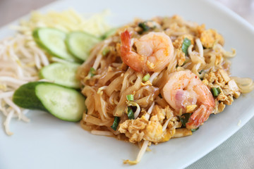 Shrimp pad thai noodles with shrimps on top , Thai food