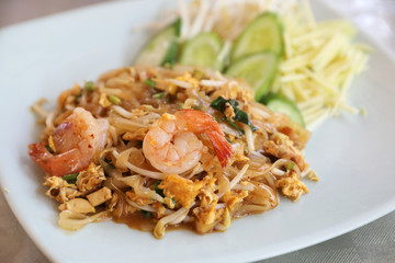 Shrimp pad thai noodles with shrimps on top , Thai food