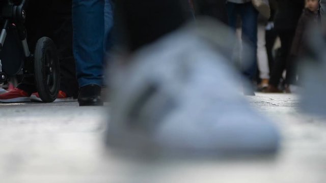 city life, hurry, frenzy - close up on people' feets walking in the city