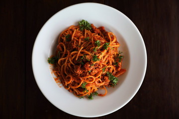 Spaghetti bolognese on wood background , italian food