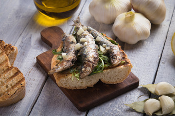 Sardine fish sandwich with garlic and olive oil