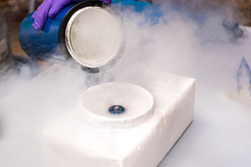 Liquid nitrogen poured for an experiment - obrazy, fototapety, plakaty