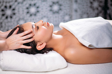 acupressure concept. massage therapy for head as an adjunct treatment. side view shot.