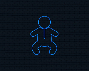 Neon light. Baby infant sign icon. Toddler boy in pajamas or crawlers body symbol. Child WC toilet. Glowing graphic design. Brick wall. Vector