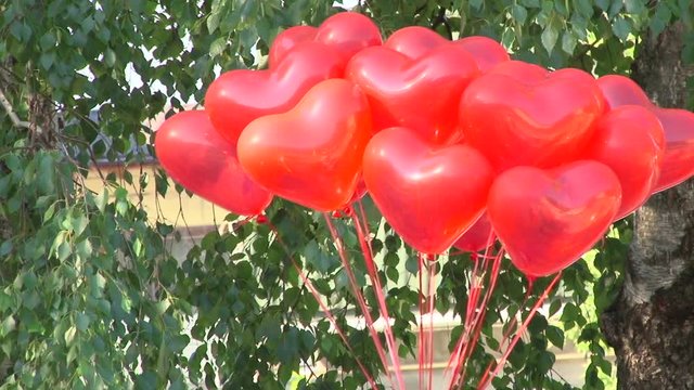Red balloons in the form of hearts