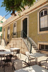 Old colorful facade with a terrace in Sesimbra