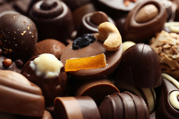 Different tasty chocolate candies, closeup