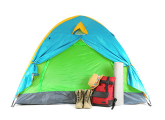 Colorful tent and camping equipment on white background