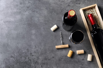 Flat lay composition with delicious red wine on grey background