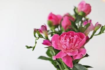 Beautiful peony flowers on light background, closeup