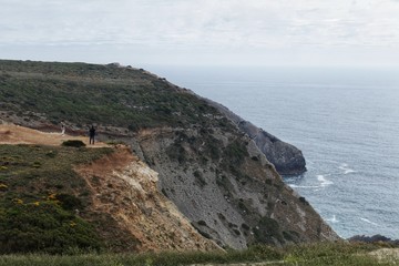 Views of the wild Atlantic Ocean with beautiful cliffs in Cape Espichel