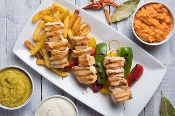 Grilled chicken meat on skewer