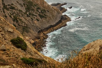Views of the wild Atlantic Ocean with beautiful cliffs in Cape Espichel