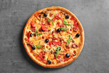 Delicious pizza with olives and sausages on table, top view