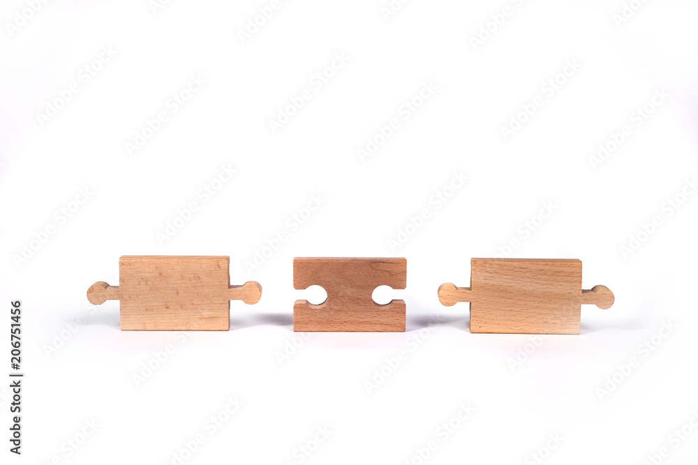 Poster wooden jigsaw puzzle with blank space. there is a matching puzzle next to it. the concept of solving