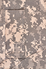 Fototapeta premium Camouflage clothes texture. Military clothes background. Close up.