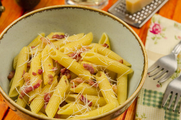 Pasta carbonara. Italian pasta with bacon. Penne alla carbonara