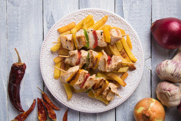 Grilled chicken meat on skewer