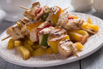 Grilled chicken meat on skewer