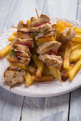 Grilled chicken meat on skewer