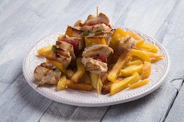 Grilled chicken meat on skewer