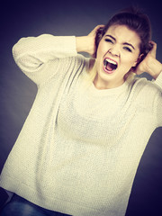 Unhappy woman screaming and yelling in pain