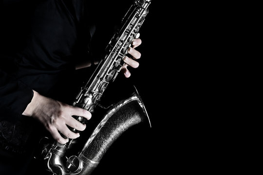 Saxophone player hands closeup. Saxophonist