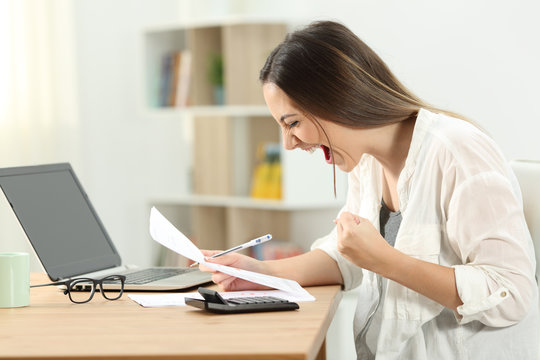 Excited woman checking bank statement