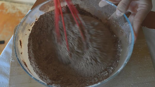 stirring chocolate flour for baking mafin