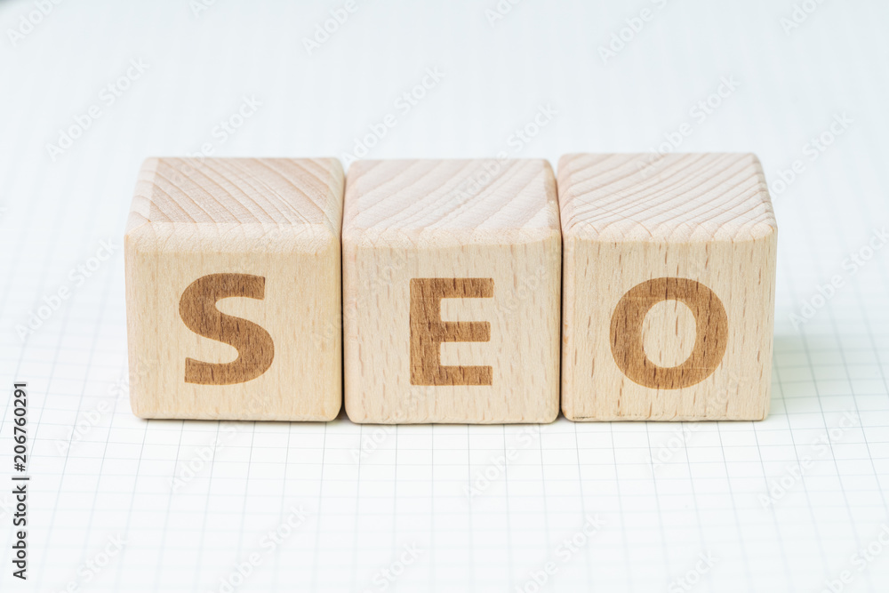 Aufkleber seo, search engine optimization ranking concept, wooden cube block with alphabets abbreviation seo a