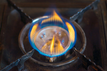 the gas burns in the gas burner of the cooker.