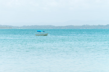 The lonely boat anchored on the sea